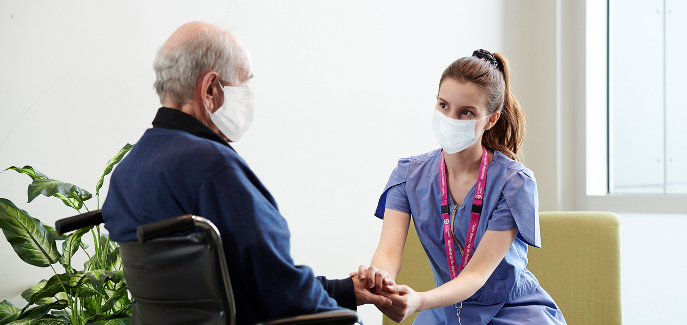 nurse and person in a wheelchair 