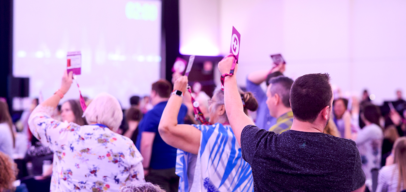 BCNU members holding up their badge during convention 2022