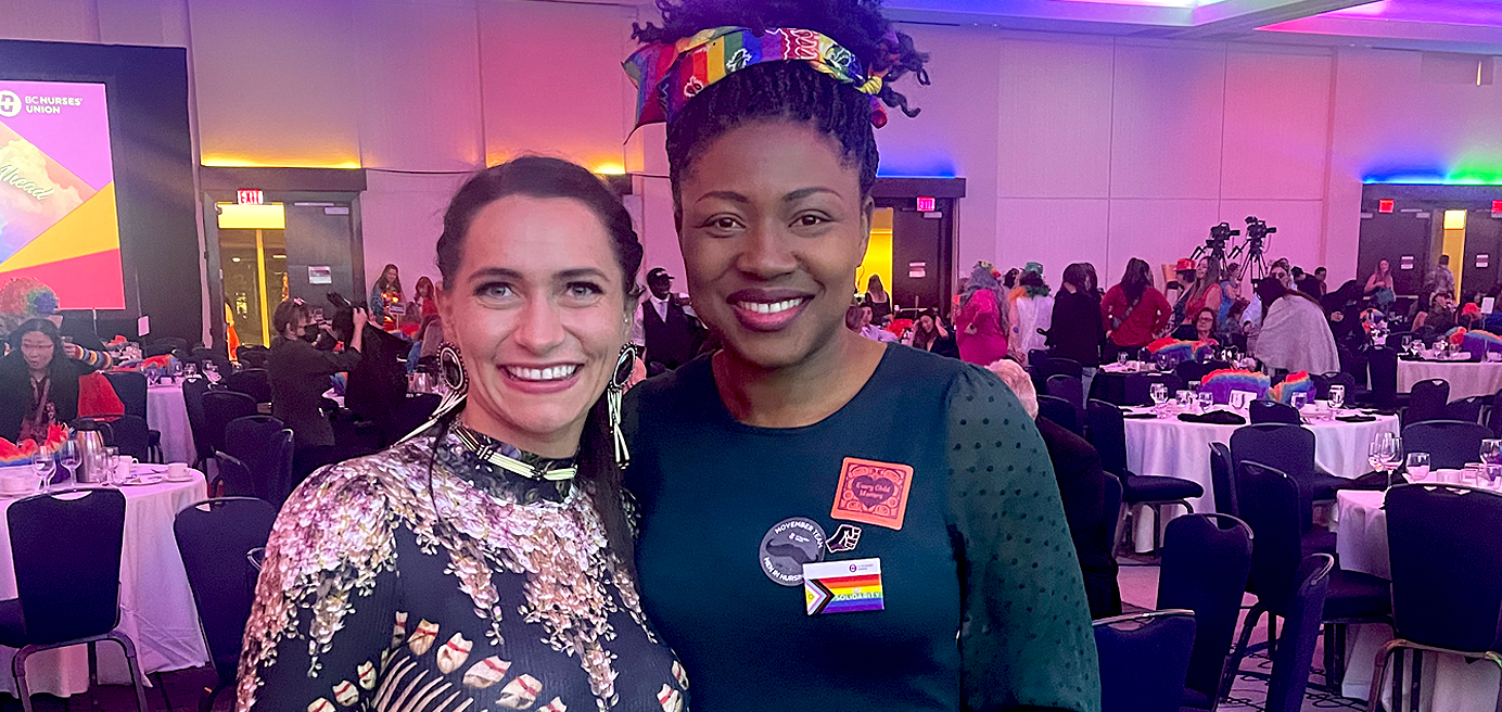 Photo of Maggie Biagioni on left and Adigo Angela Achoba-Omajali on right at Convention Banquet