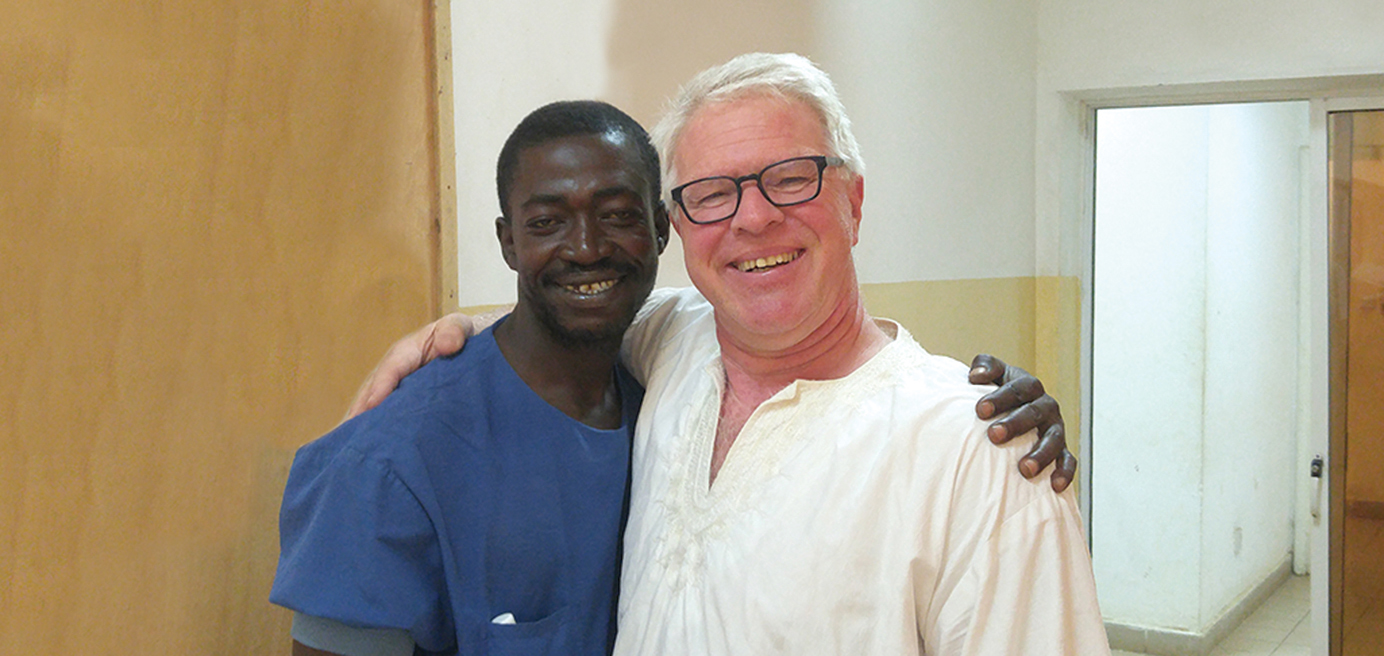 Kamloops OR nurse Koos Meijerhof (right) poses with medical device sterilization worker Pa Lam at the Serrekunda Hospital in The Gambia