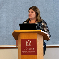 Update magazine - Spring 2025 - Leading by Example - Adriane at Podium