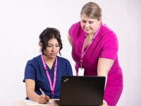 Two nurses at a computer