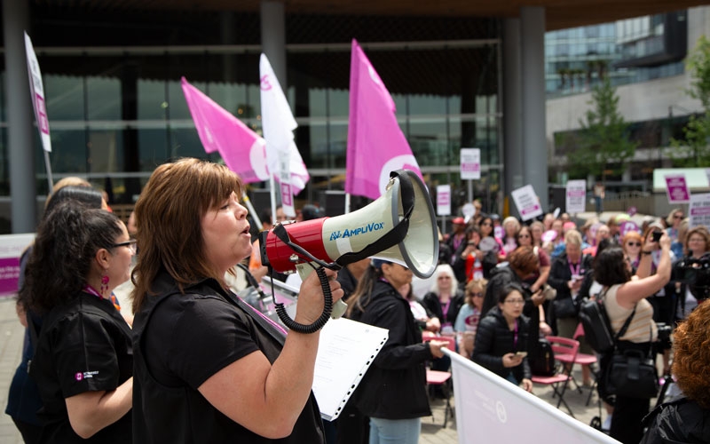BCNU Vice President Adriane Gear leads members in a rally chant at Jack Poole Plaza.