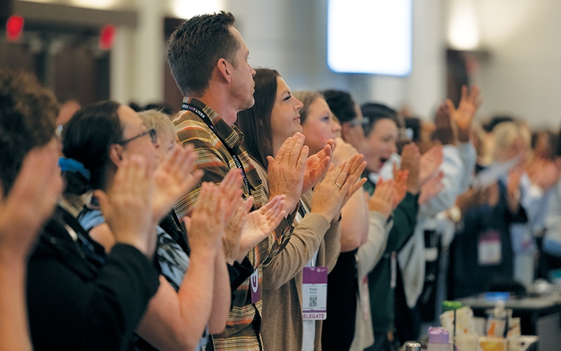 Convention delegates enjoy a presentation.