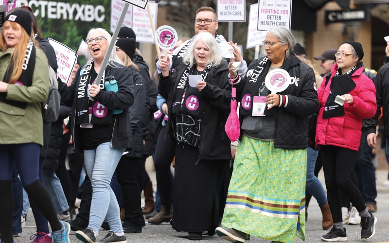 Members march in downtown Vancouver on day two of the conference. 