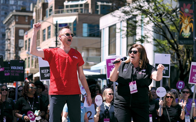 BCNU Vice-President Tristan Newby and President Adriane Gear lead a chant during the convention rally. 