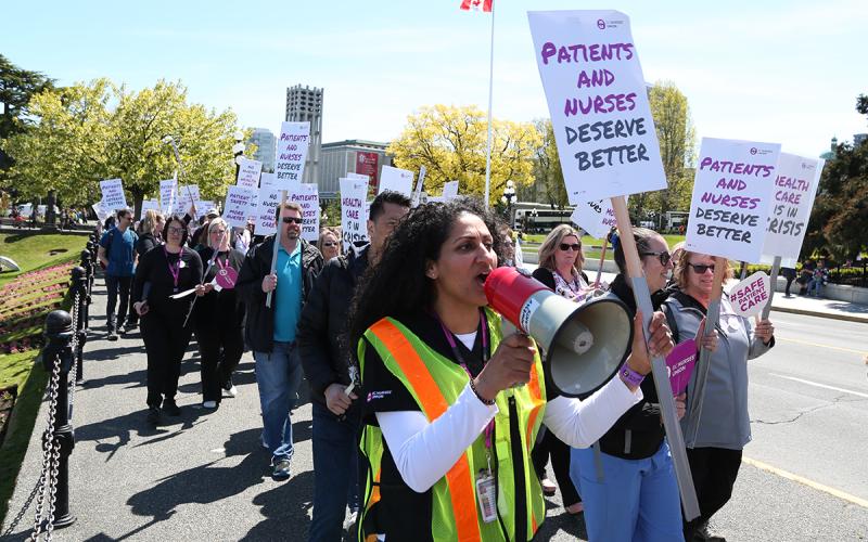 BCNU members take their message to the public in a march along Victoria’s Inner Harbour May 10.