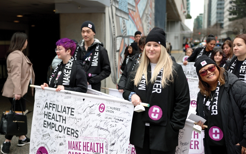 Members who work for affiliate health employers march in the rally on day two. 