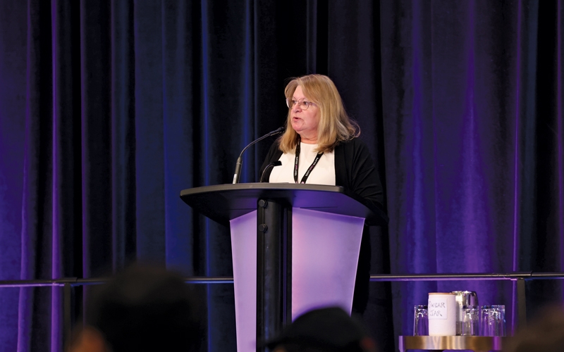 BCNU Treasurer Sharon Sponton speaks to delegates.