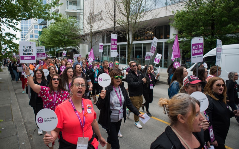 Members march down Burrard Street to raise awareness of the nurse staffing crisis.