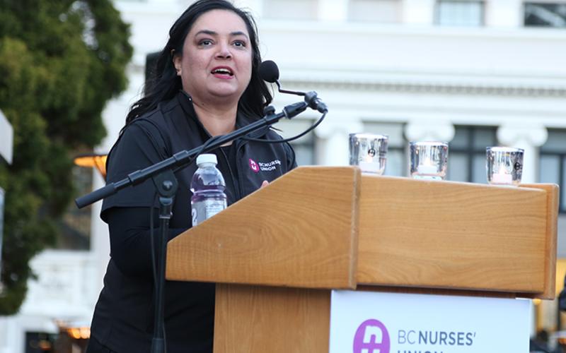 BCNU President Aman Grewal welcomes members and guests to an evening Vigil to Heal Health Care on the evening of May 9.