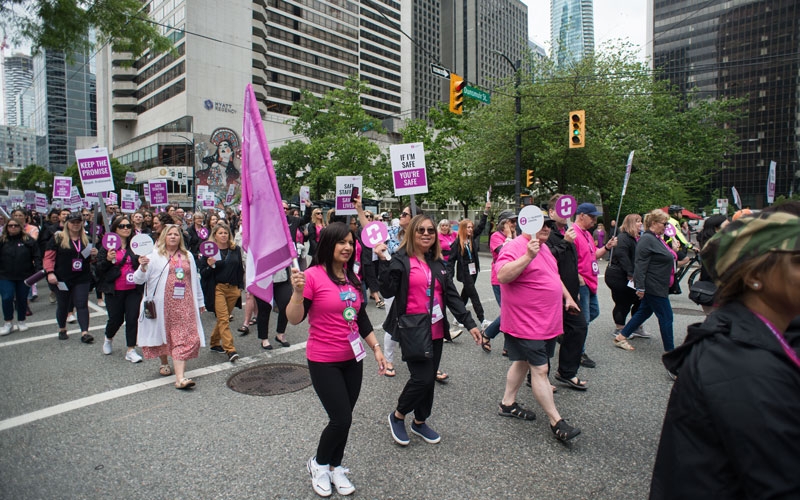 Members march down Burrard Street to raise awareness of the nurse staffing crisis.