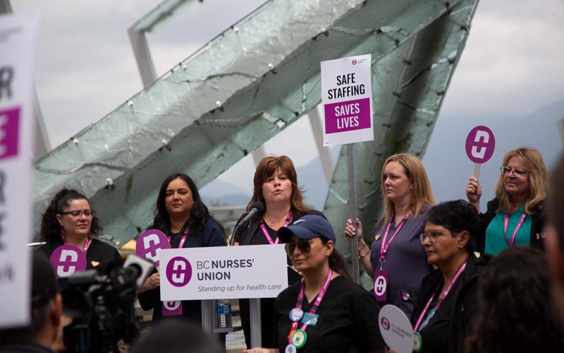 Provincial executive committee members address nurses and members of the public gathered in Jack Poole Plaza.