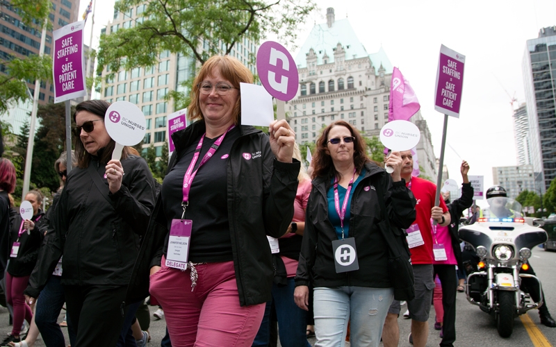 BCNU North West region delegates march with members on Burrard Street. 