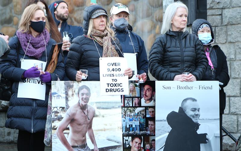 Family members of people lost to the poisoned drug crisis attend BCNU-hosted evening vigil on May 9.