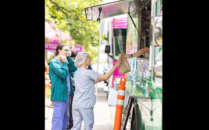 Members receiving lunch from the White Spot food truck.