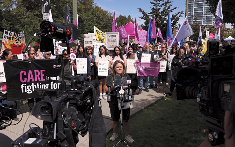 Canadian Federation of Nurses’ Unions President Linda Silas speaks in front of picketing members