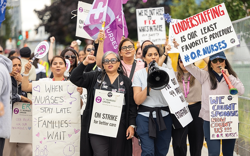 Members take part in a picket line outside of Surrey Memorial Hospital on July 9.